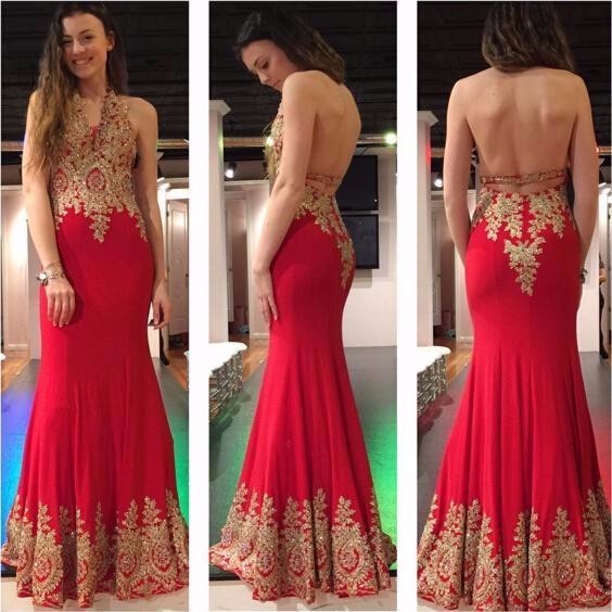 Red prom dress store with gold accents